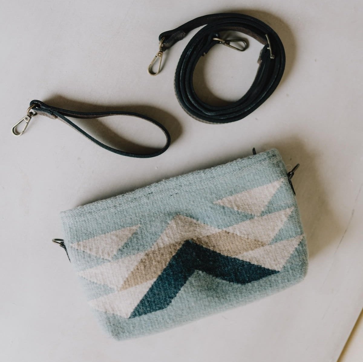 AMASOUK handwoven wool Reflejos convertible clutch/wristlet/crossbody bag, featuring a Zapotec pattern in stunning shades of blue. A versatile 3-in-1 accessory for any occasion.