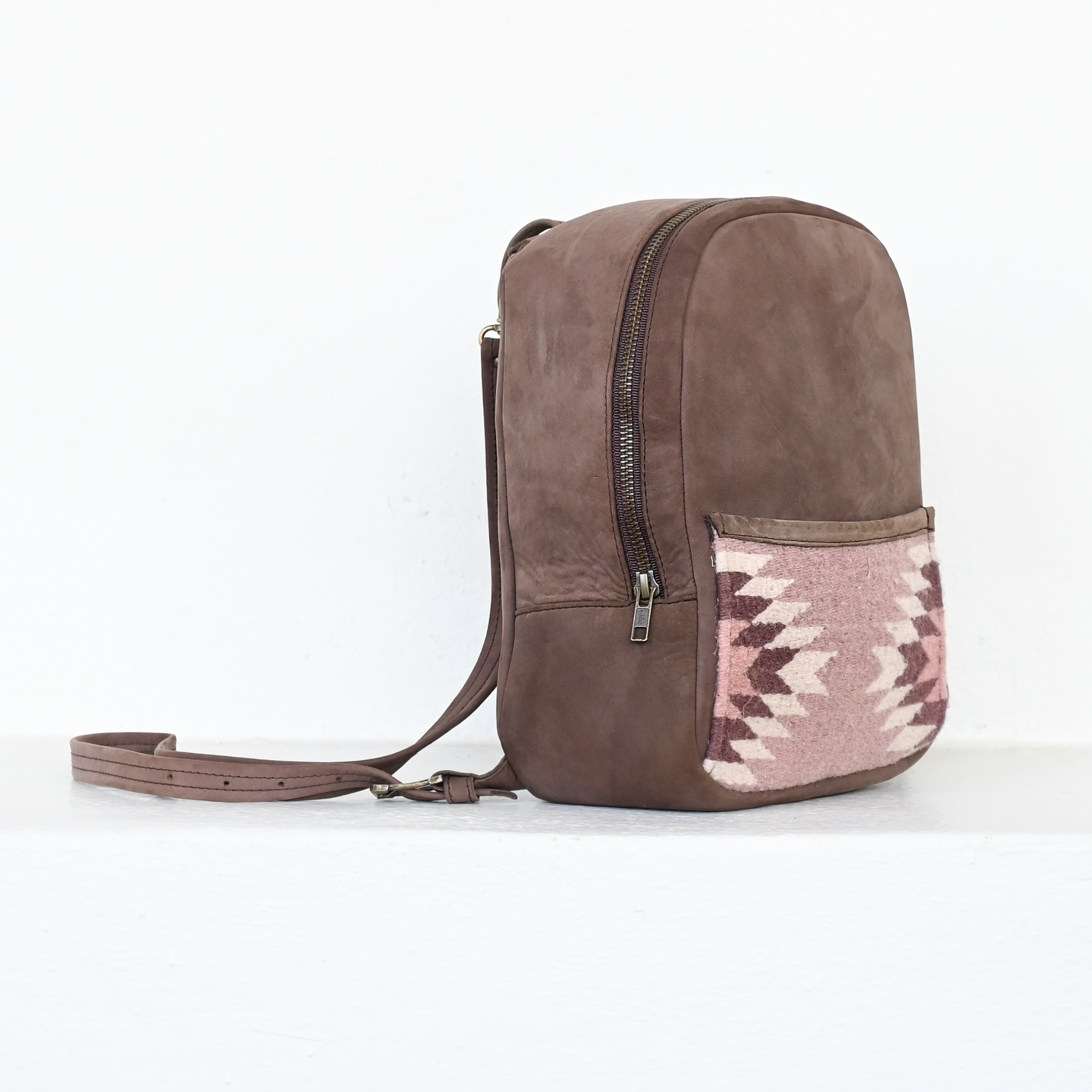AMASOUK Aguila Mini Backpack with a unique combination of brown leather and sand and purple wool. A stylish and functional accessory for any occasion.