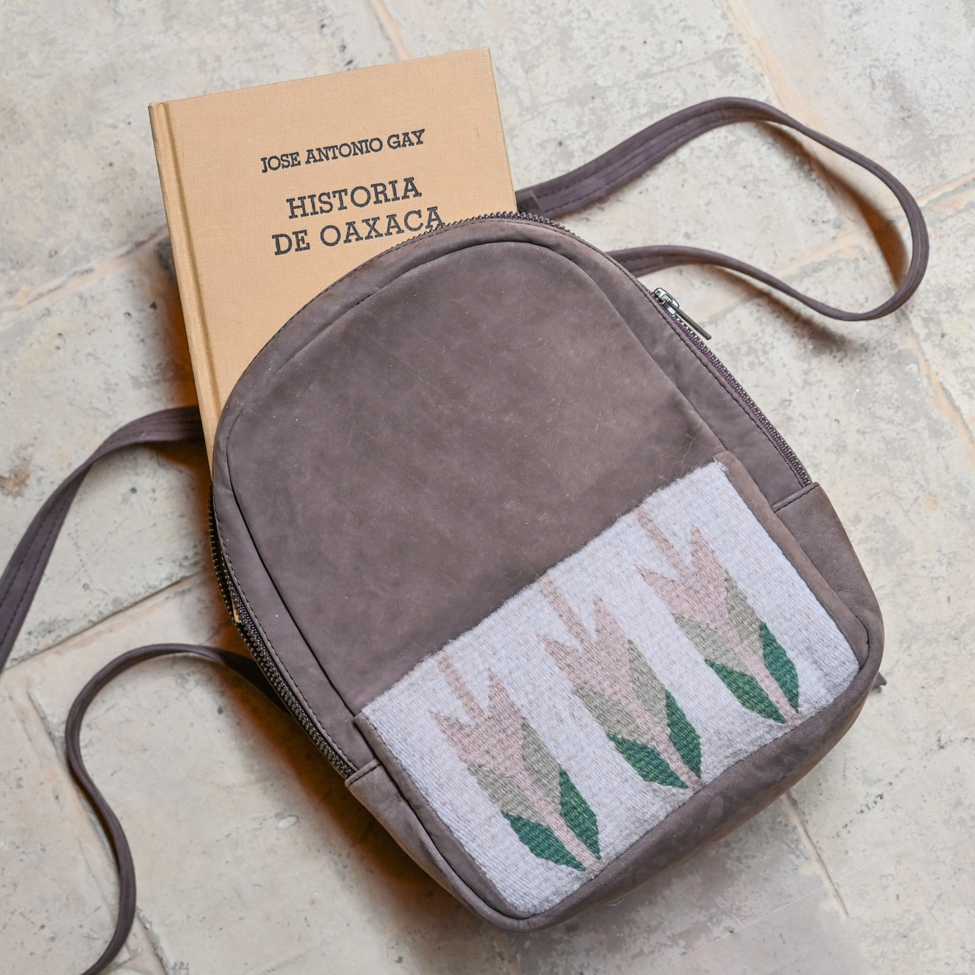 AMASOUK Arbol Mini Backpack in brown leather and light green and cream wool. A beautiful fusion of durable leather and soft wool for everyday style and functionality.