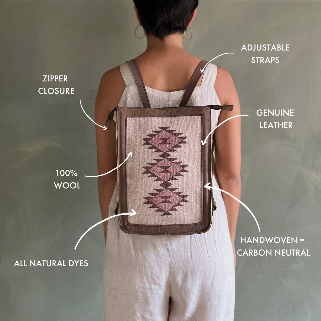 Woman carrying the AMASOUK Mora Convertible Backpack/Crossbody, a versatile two-in-one design in tan leather and handwoven wool with cream and rosy tones. Stylish and functional for any occasion. Zapotec patterns.