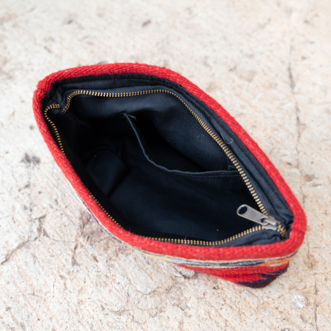 Interior view of handwoven pouch with abstract Zapotec arrow design in bold colors featuring internal pocket; perfect for makeup, wallet, or daily essentials.