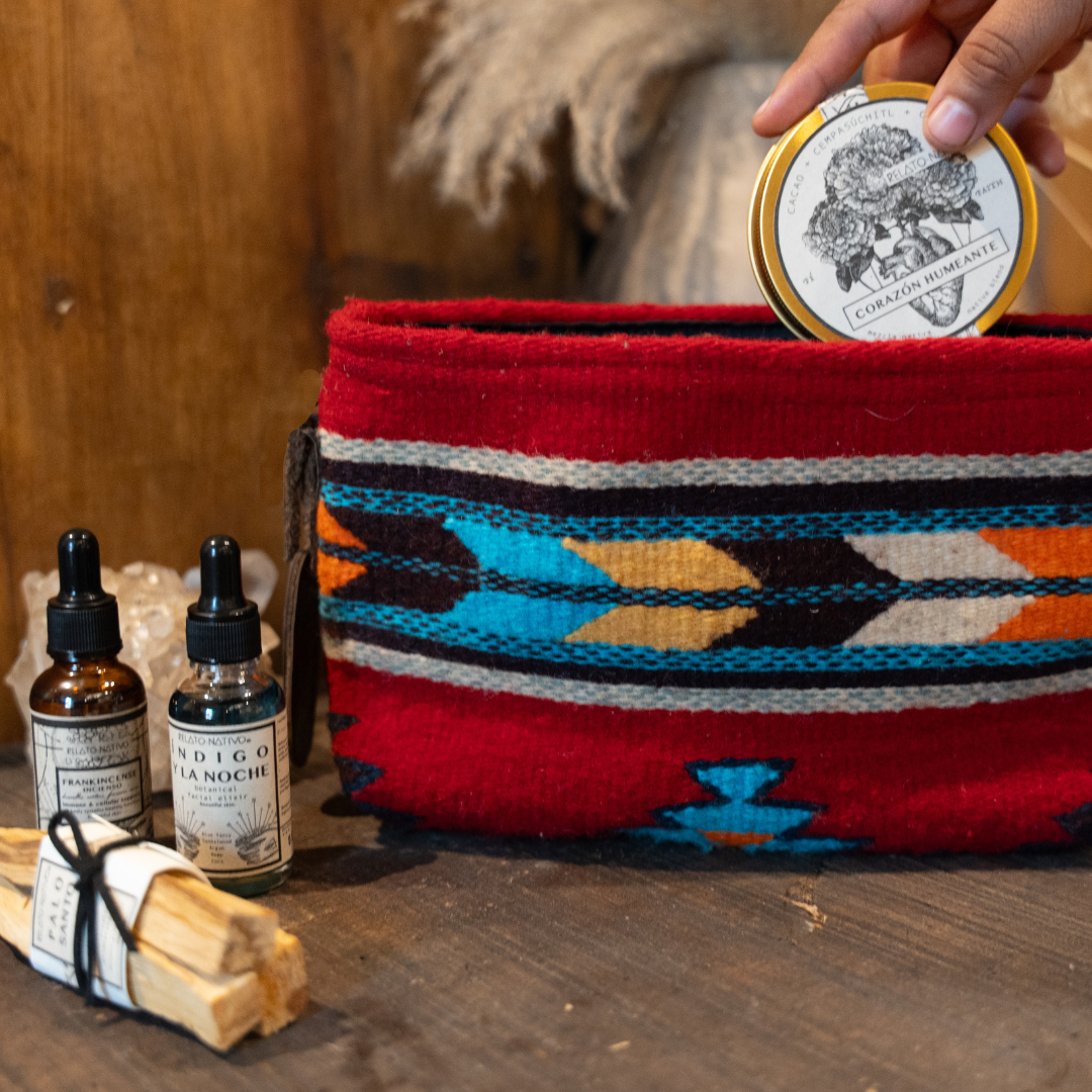 Handwoven pouch with abstract Zapotec arrow design in bold colors featuring internal pocket; perfect for makeup, wallet, or daily essentials.