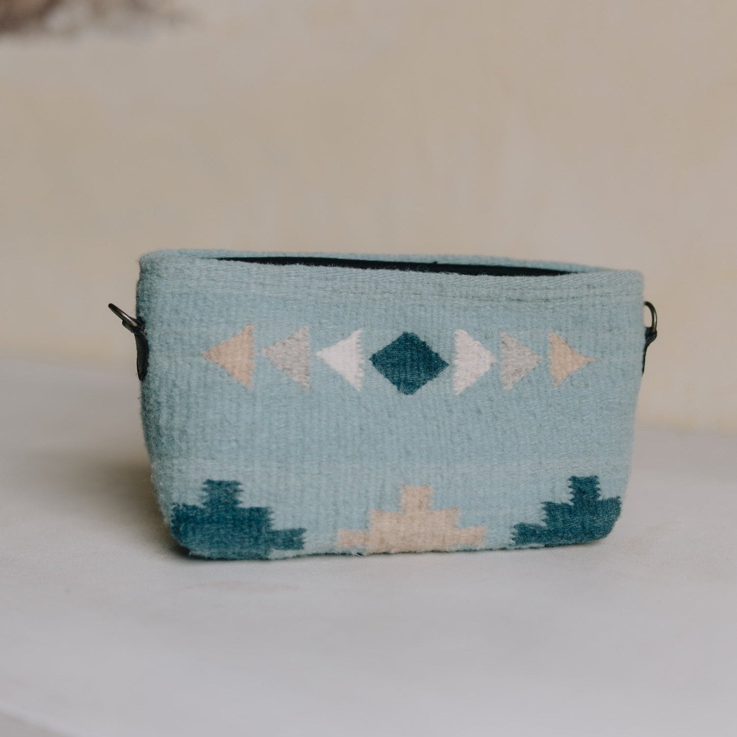 Cielito Convertible Clutch/Wristlet/Crossbody Bag by AMASOUK, showcasing a handwoven wool design with a Zapotec pattern in rich blue tones. Stylish and functional for everyday use.