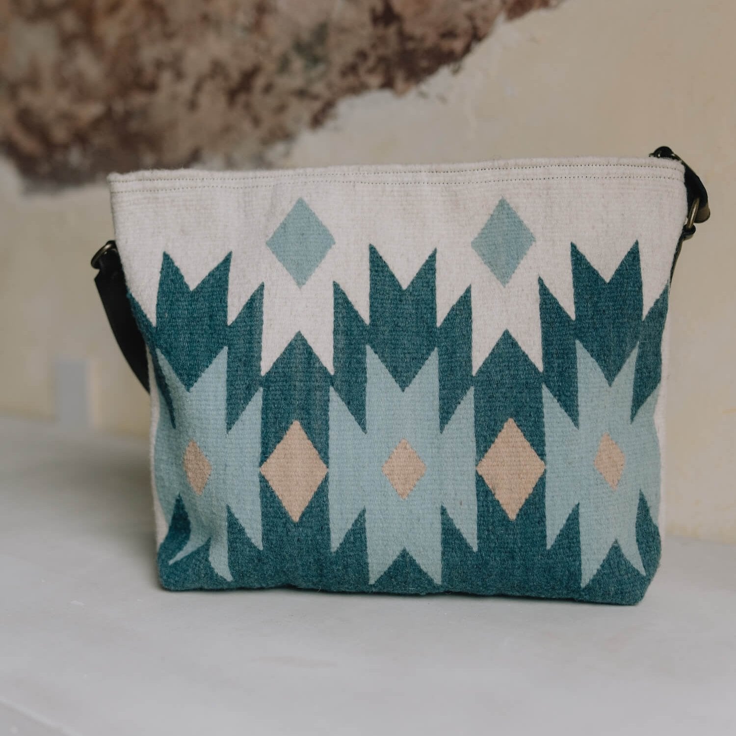 AMASOUK handwoven wool Alcala Shoulder/Crossbody Bag, featuring a striking design in blue, ivory, and honey colors. Stylish and versatile for day-to-night use.