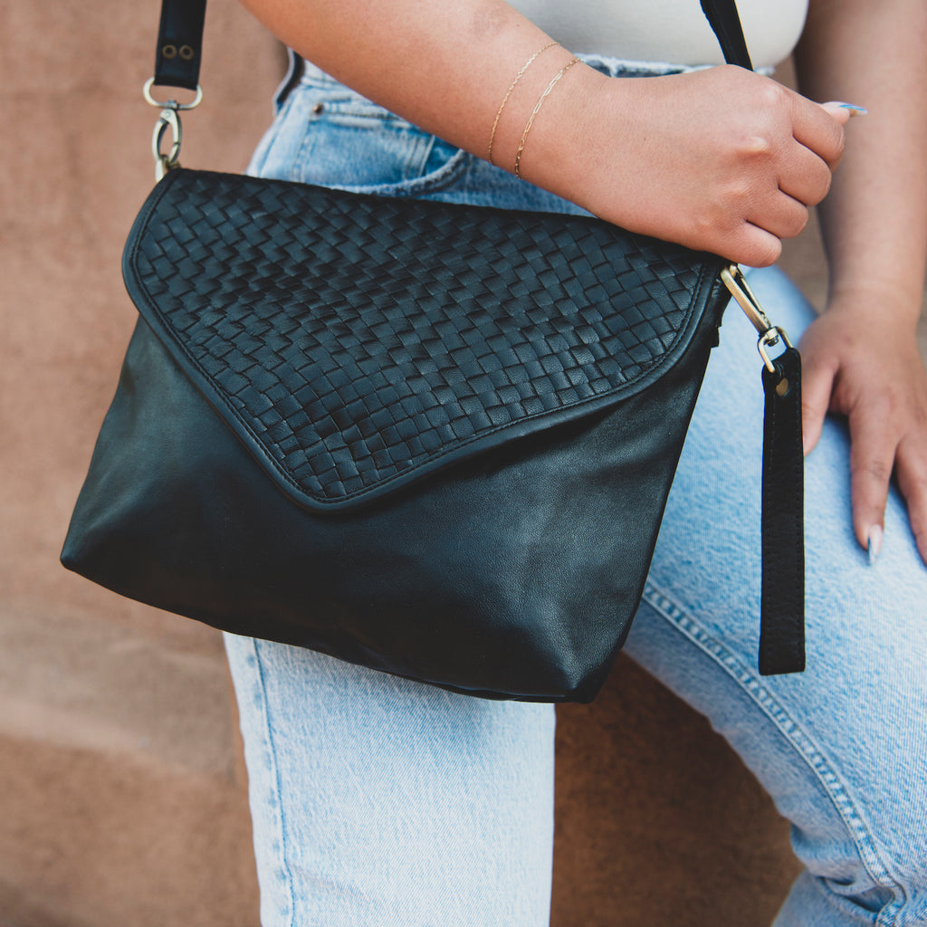 Hand-woven cross-body leather bag in black — Kmana