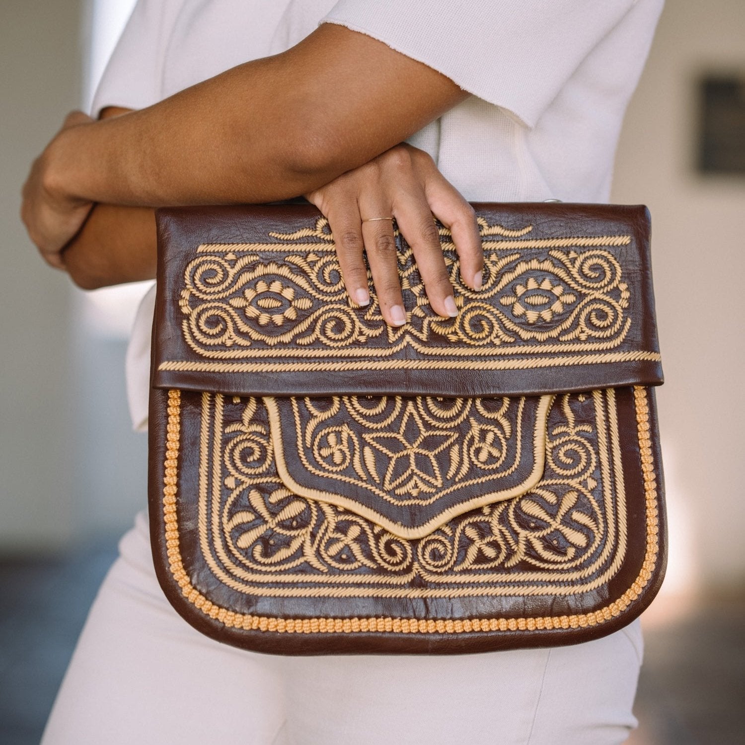 Brown Embroidered Leather Bag by AMASOUK